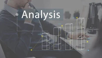 Business professional analyzing bar chart data with digital overlay, representing AI-driven data analysis and business intelligence